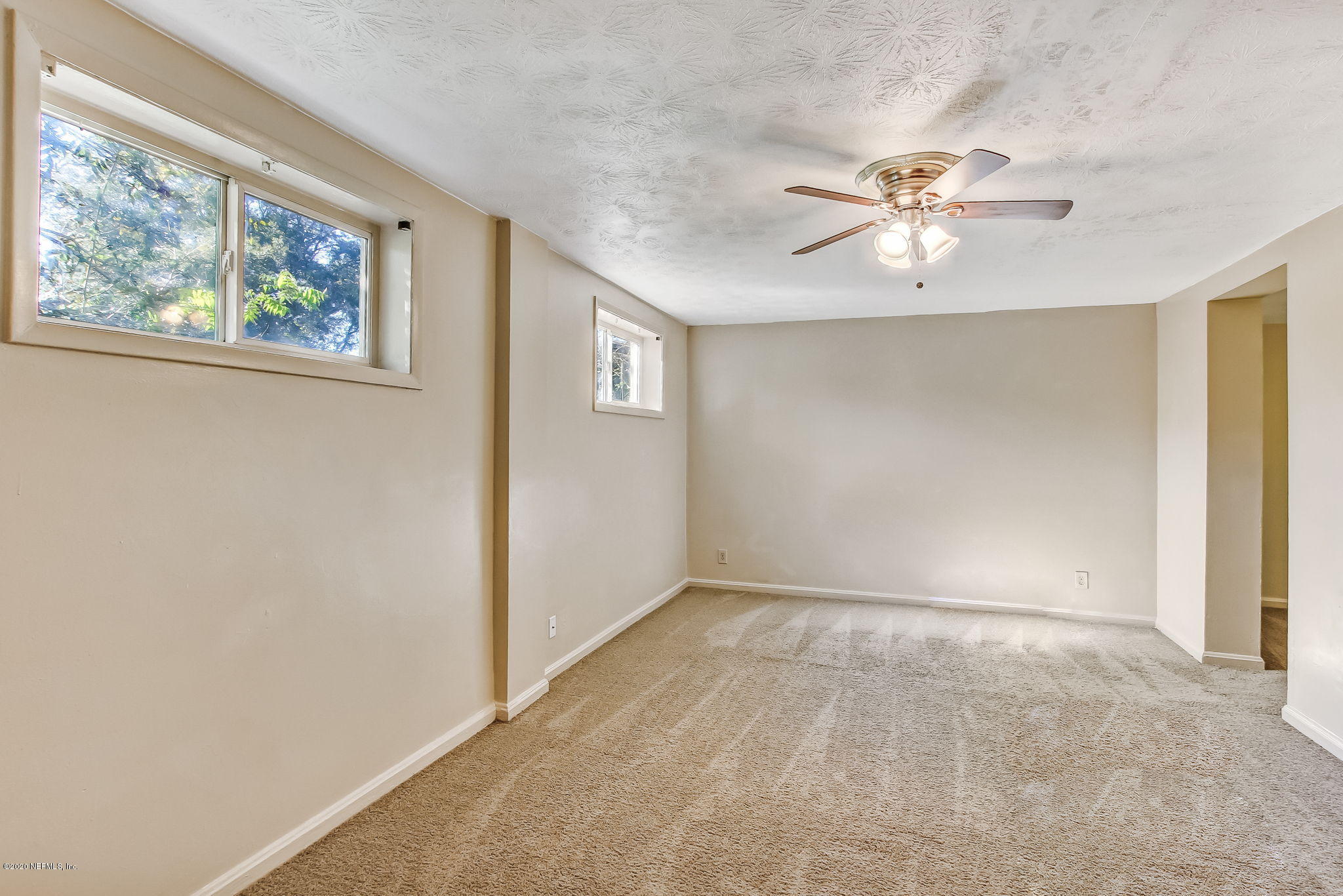 6815 King Arthur Road Jacksonville, FL 32211 - Photo 7 of 32 a view of an empty room with a window