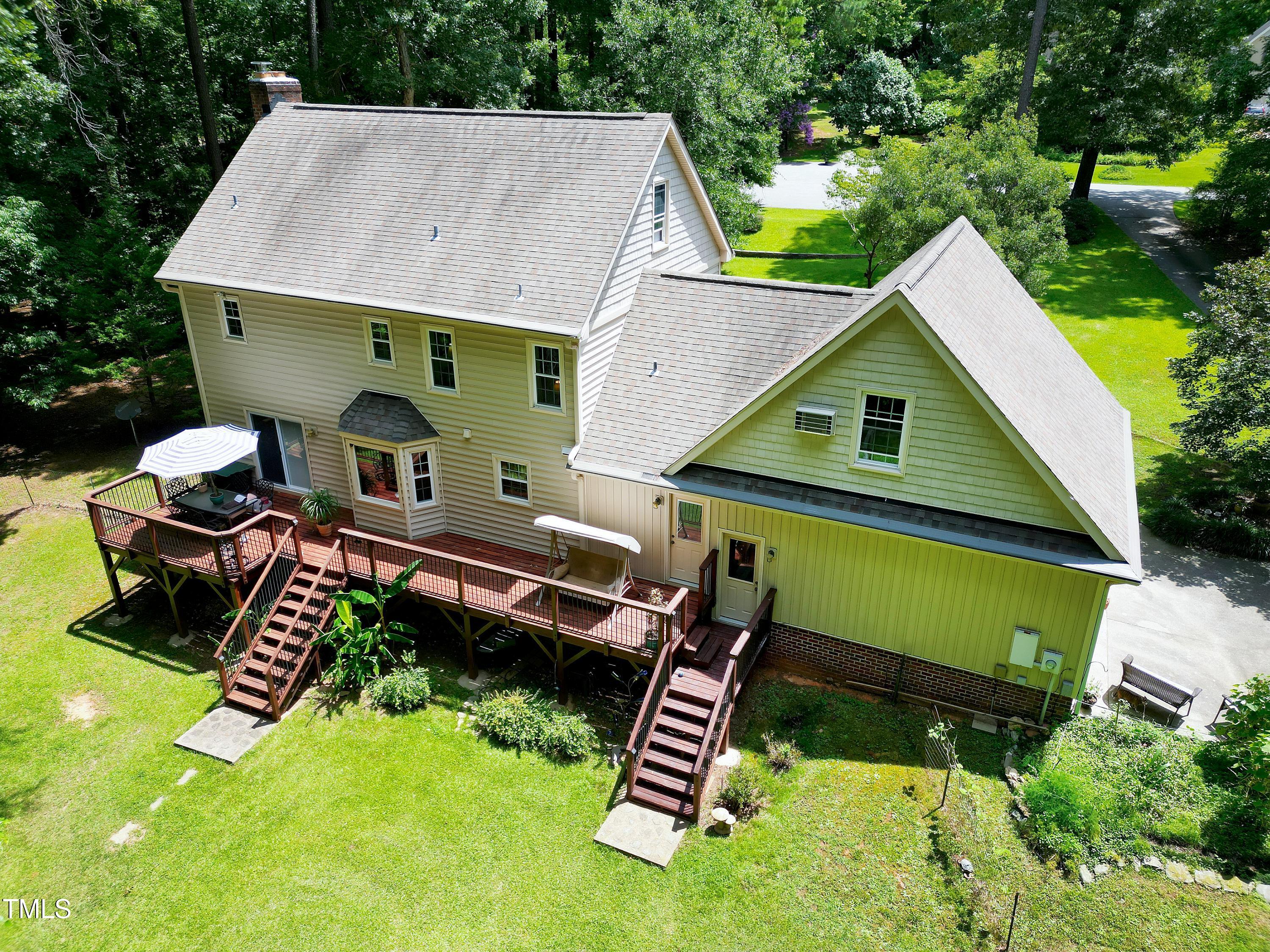 6309 Windy Ridge Court Raleigh, NC 27606 - Photo 2 of 53 a aerial view of a house with a yard