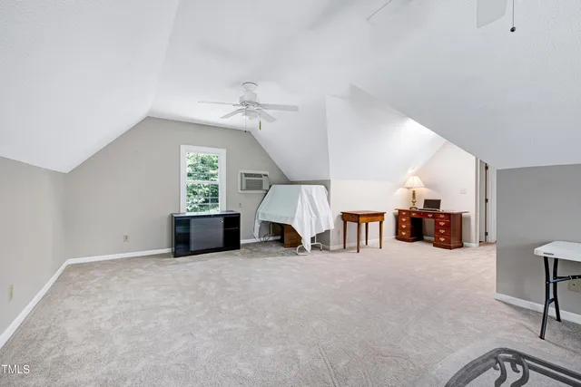 a view of a livingroom with furniture and a flat screen tv