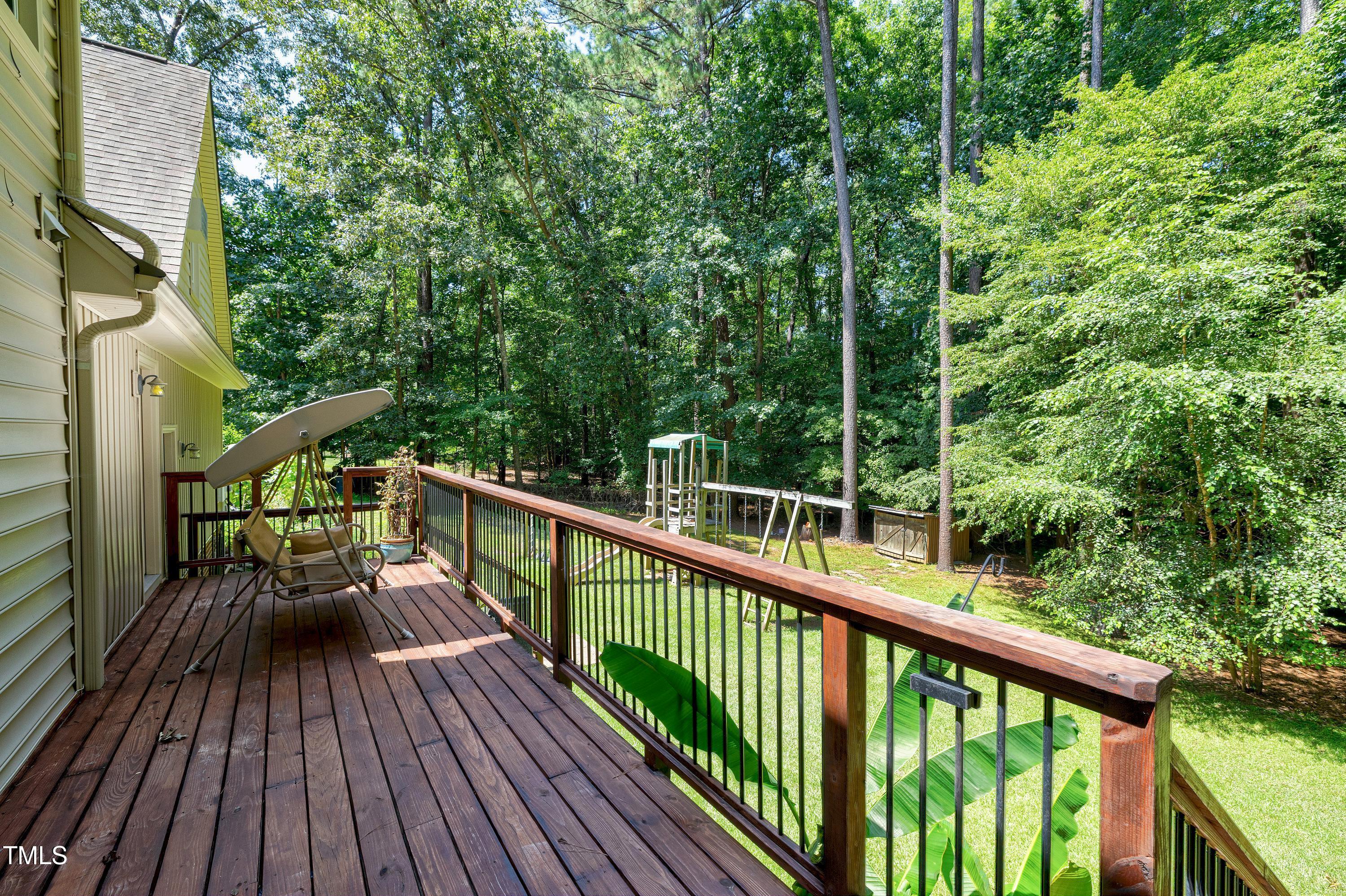 6309 Windy Ridge Court Raleigh, NC 27606 - Photo 39 of 53 a view of balcony with wooden floor and fence