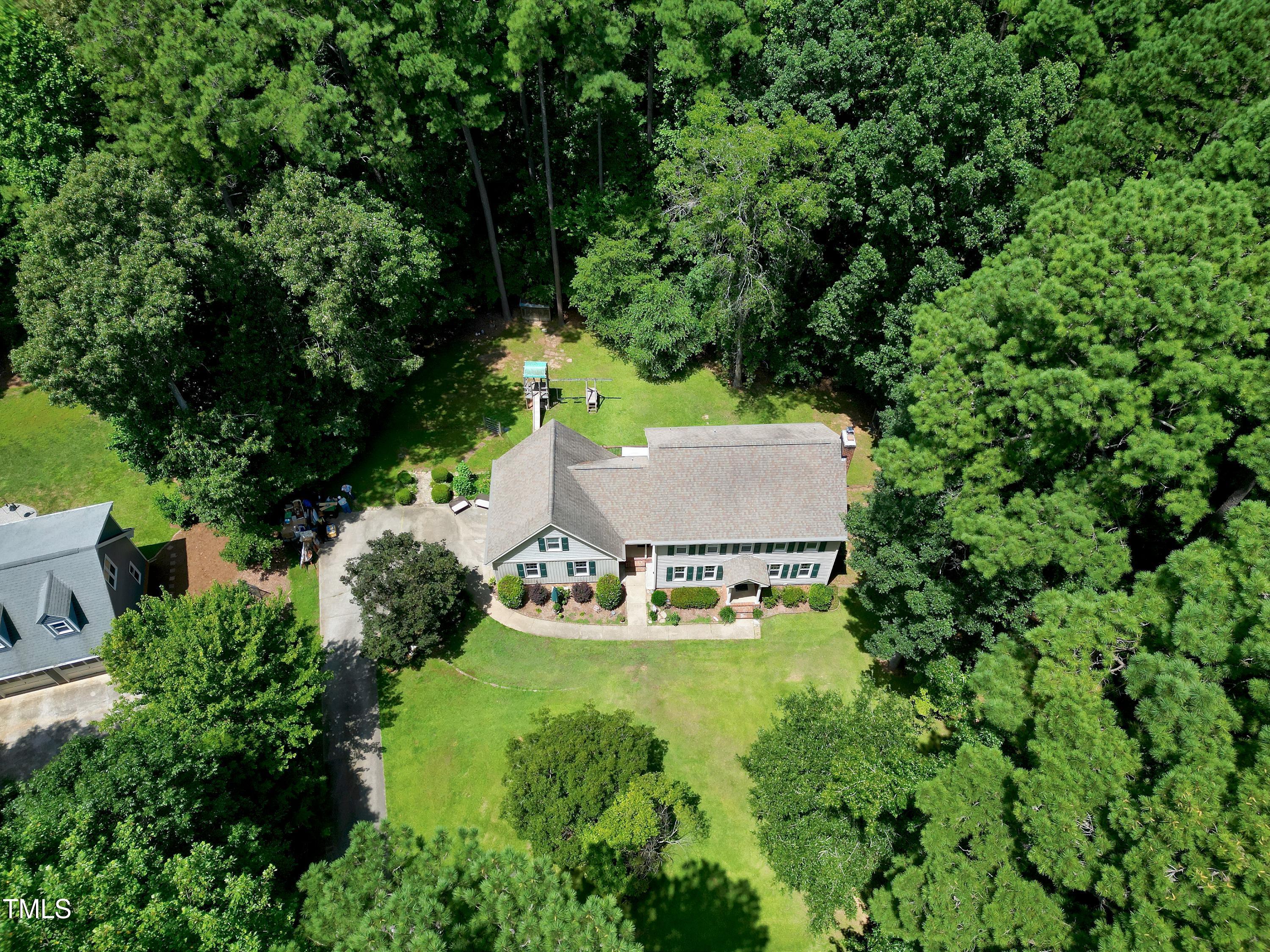 6309 Windy Ridge Court Raleigh, NC 27606 - Photo 48 of 53 an aerial view of a house with yard swimming pool and outdoor seating