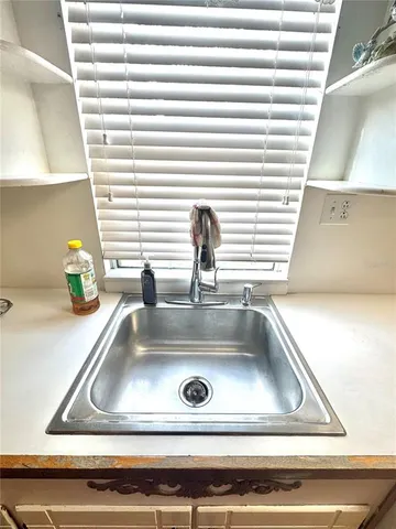a stove top oven sitting inside of a kitchen
