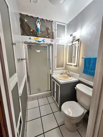 a view of an empty room and a window