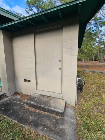 a front view of a house with grey walls