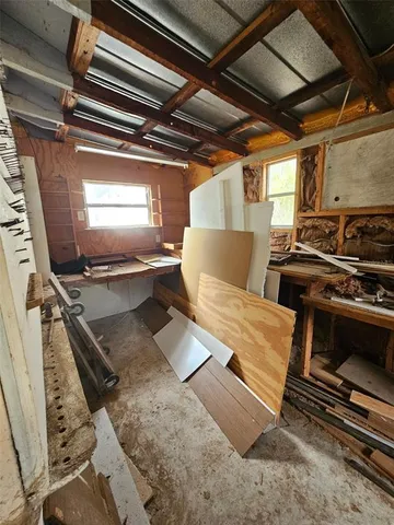 a backyard of a house with outdoor seating