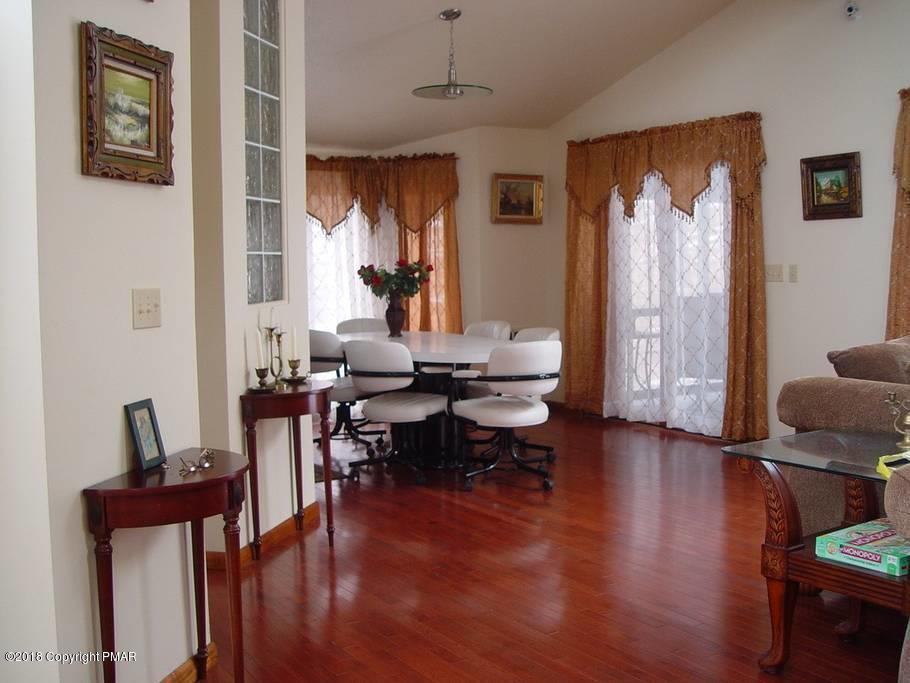 179 Radcliff Road Bushkill, PA 18324 - Photo 4 of 32 a view of a livingroom with furniture window and wooden floor