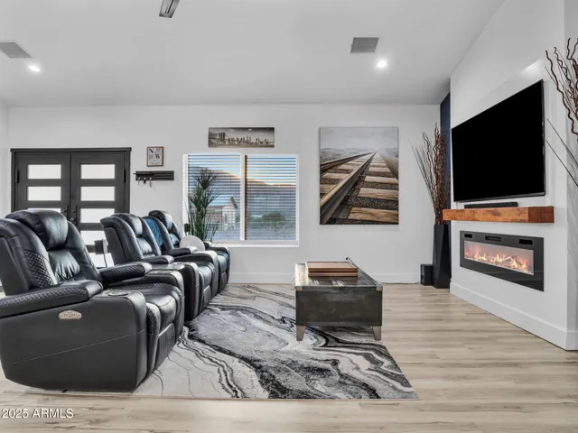 a kitchen with granite countertop a counter top space a sink stainless steel appliances and cabinets