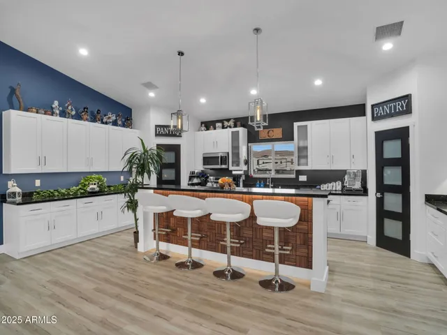 a kitchen with lots of counter top space and a sink