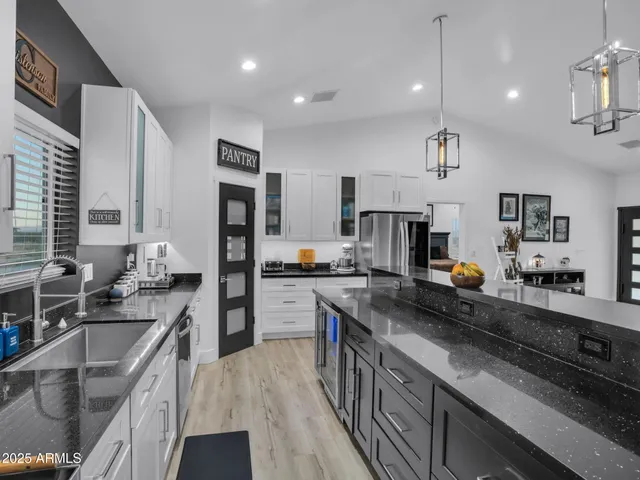 a living room with furniture a rug and a wooden floor