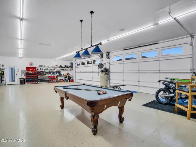 a view of sitting area with furniture and potted plants