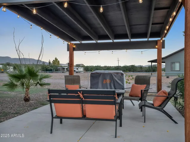 an aerial view of a house with outdoor space lake view and mountain view