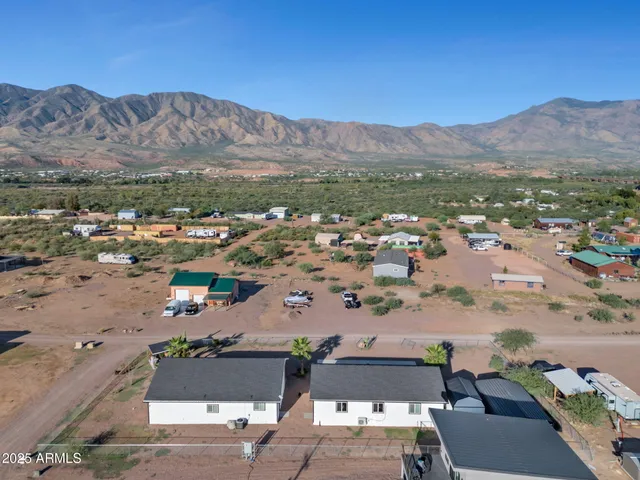 an aerial view of a house with sitting area
