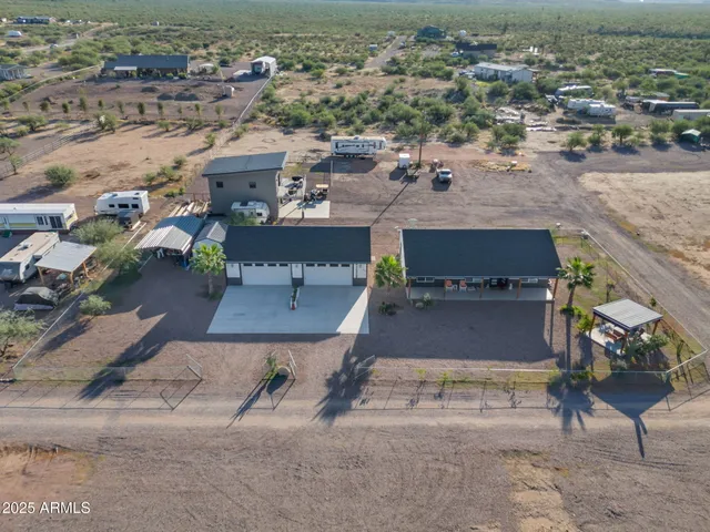 an aerial view of a house with a garden