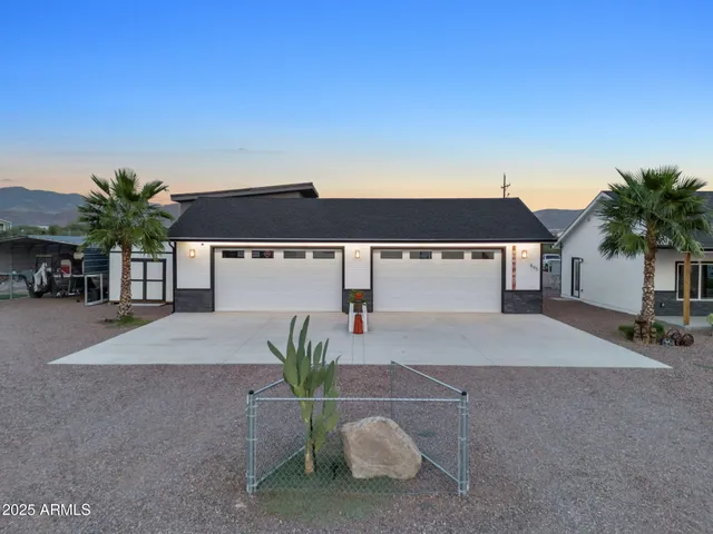 a view of a house with a yard and sitting space