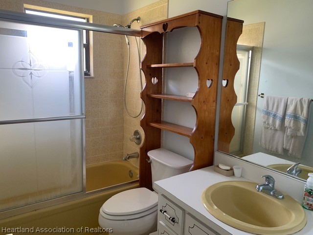 108 Lime Road Northeast Lake Placid, FL 33852 - Photo 11 of 17 a bathroom with a sink toilet and shower