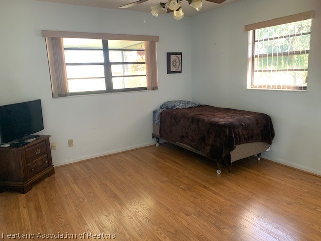 108 Lime Road Northeast Lake Placid, FL 33852 - Photo 13 of 17 a bedroom with a bed and a flat screen tv