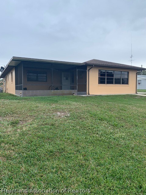 108 Lime Road Northeast Lake Placid, FL 33852 - Photo 3 of 17 a house view with a garden space