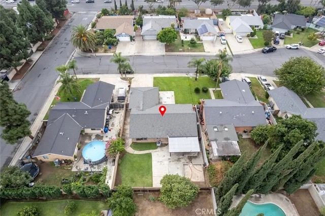 an aerial view of residential houses with outdoor space