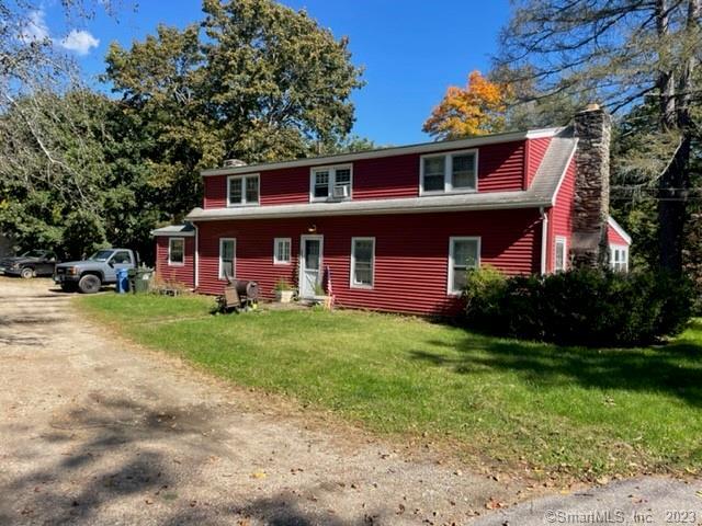 107 Wawecus Hill Road Norwich, CT 06360 - Photo 1 of 1 a front view of a house with yard and green space