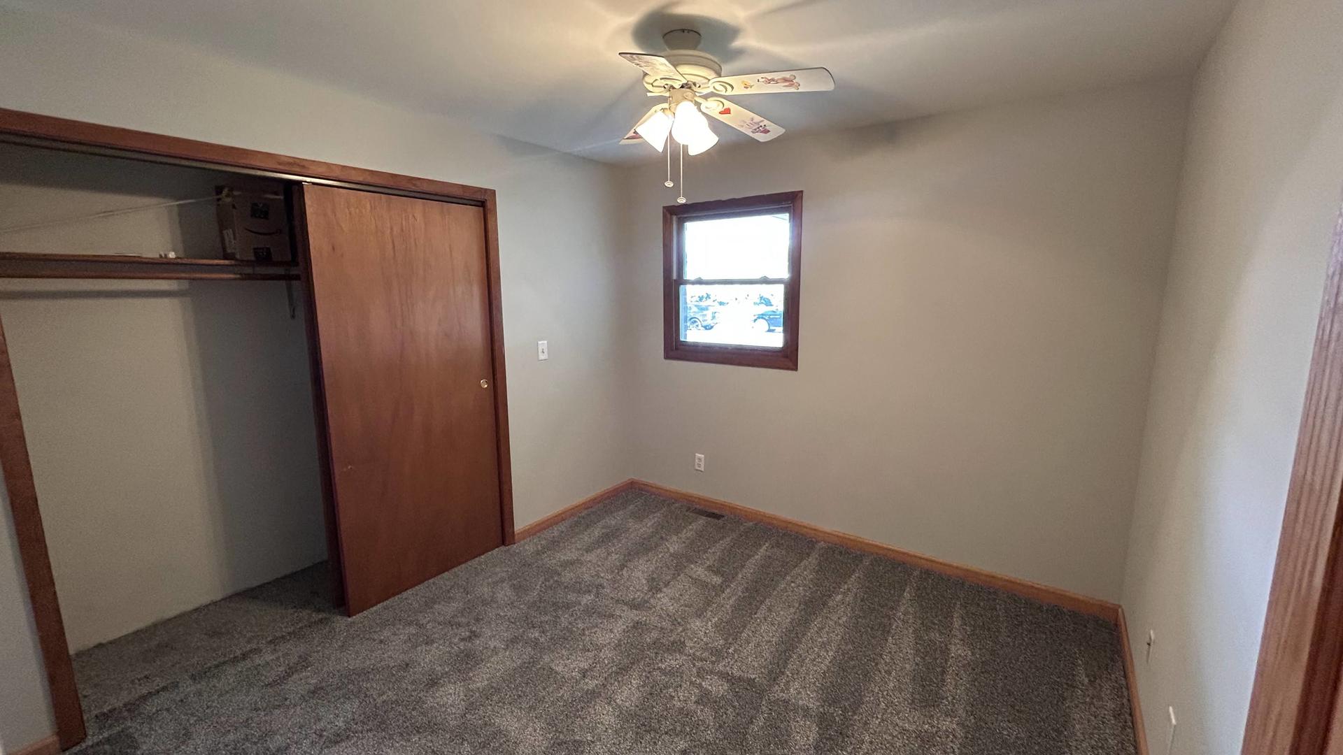 745 Longlane Road New Lenox, IL 60451 - Photo 11 of 17 an empty room with windows and fan