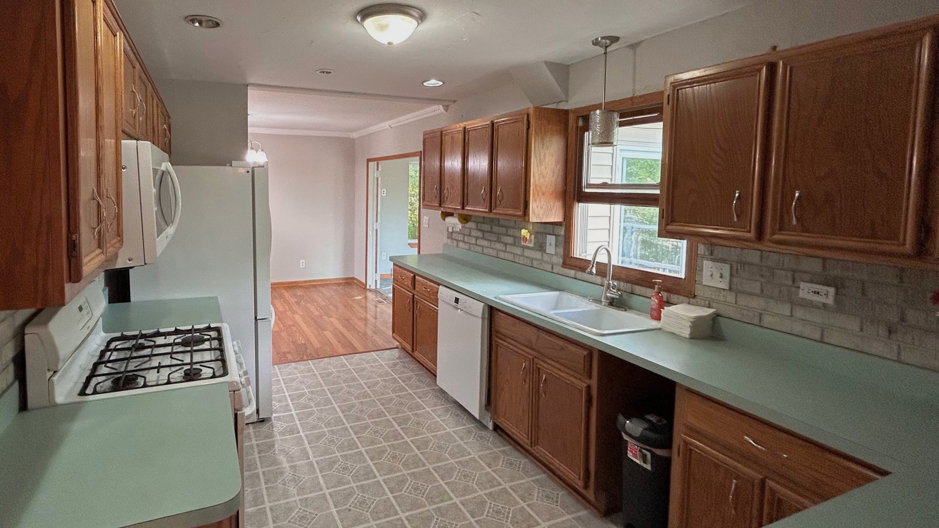 745 Longlane Road New Lenox, IL 60451 - Photo 4 of 17 a kitchen with stainless steel appliances a sink stove and refrigerator