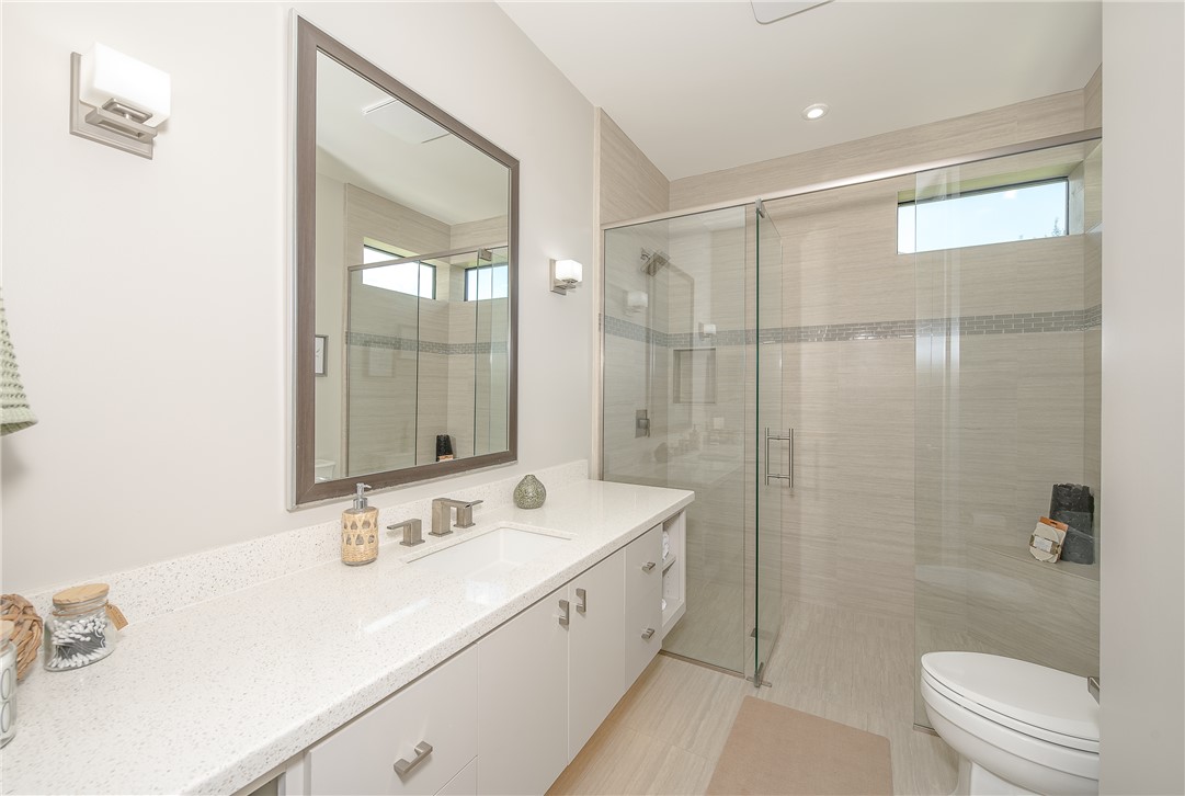 3320 Sycamore Trail Bryan, TX 77807 - Photo 28 of 48 Full bathroom with toilet, vanity, and a stall shower