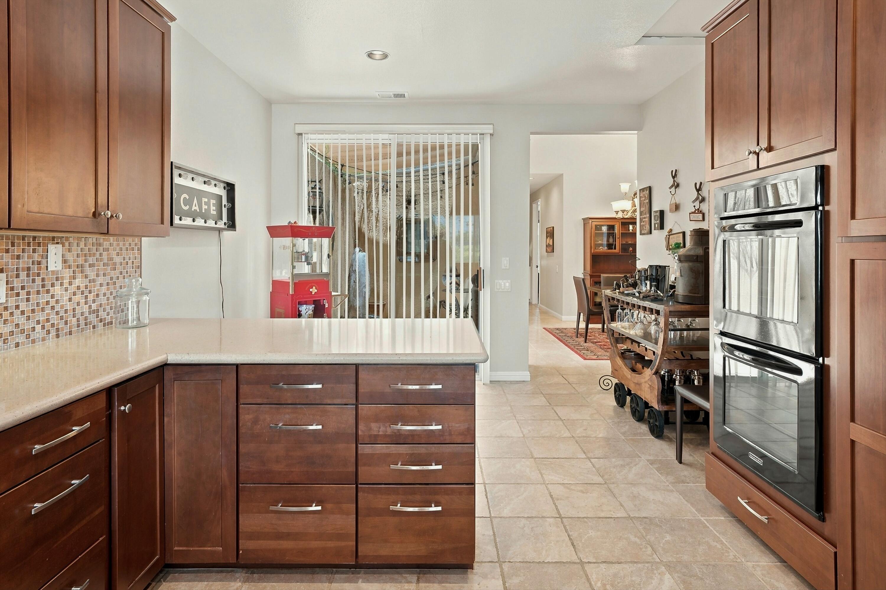 138 Lakeshore Drive Rancho Mirage, CA 92270 - Photo 10 of 30 a kitchen with a refrigerator and cabinets