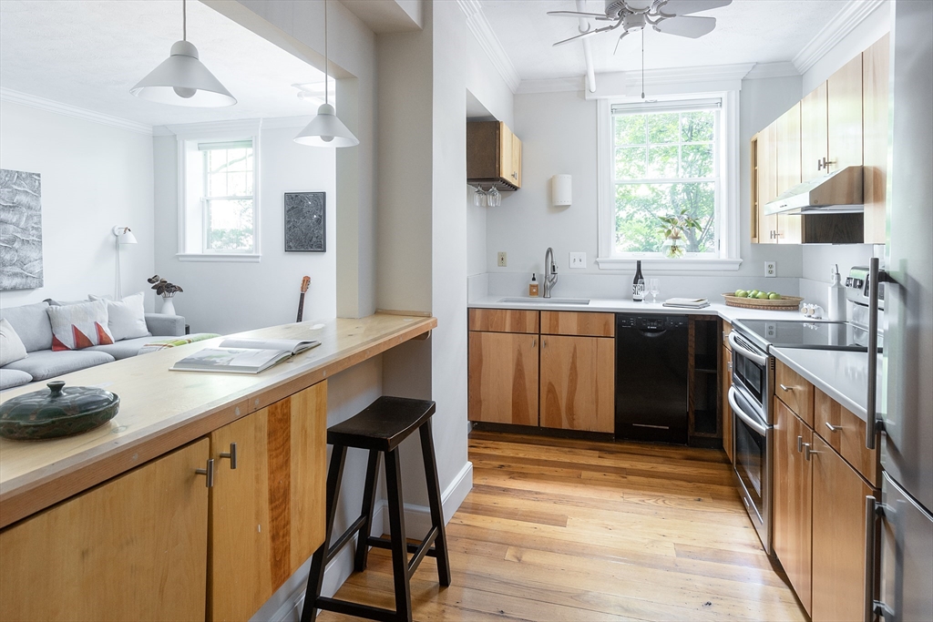 126 Amory Street, Unit B4 Brookline, MA 02446 - Photo 5 of 8 a kitchen with a sink appliances and cabinets