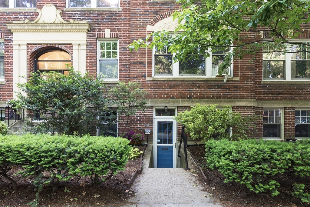 126 Amory Street, Unit B4 Brookline, MA 02446 - Photo 8 of 8 front view of a house with potted plants