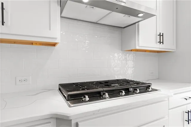 a bathroom with a sink and glass door shower
