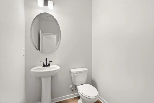 a spacious bathroom with a shower sink and mirror
