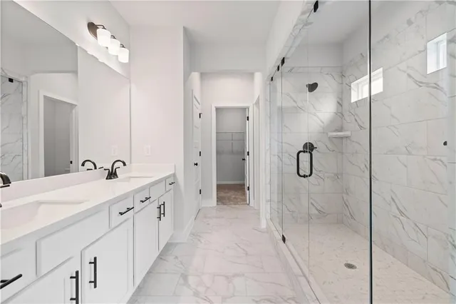a bathroom with a sink double vanity and a mirror