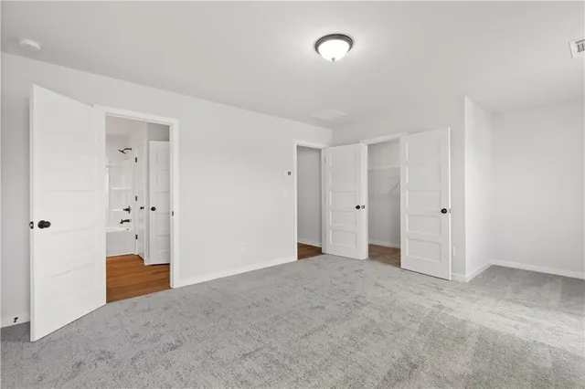 a view of a kitchen and kitchen with a sink refrigerator