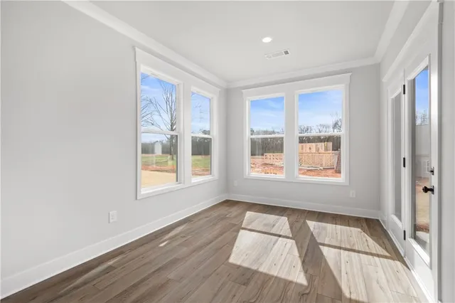 a bathroom with a granite countertop toilet and a sink