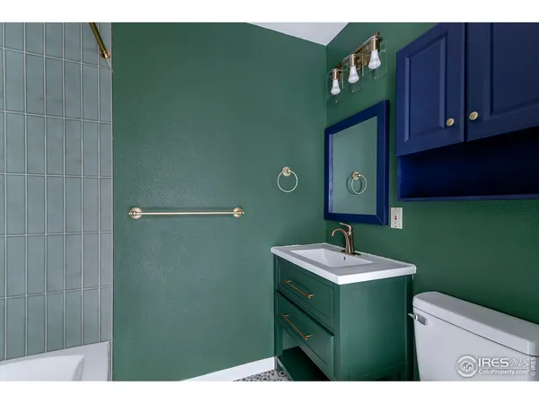 a bathroom with a sink toilet and vanity