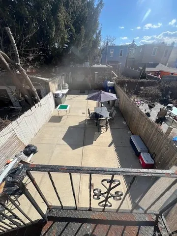 a terrace with outdoor seating and city view