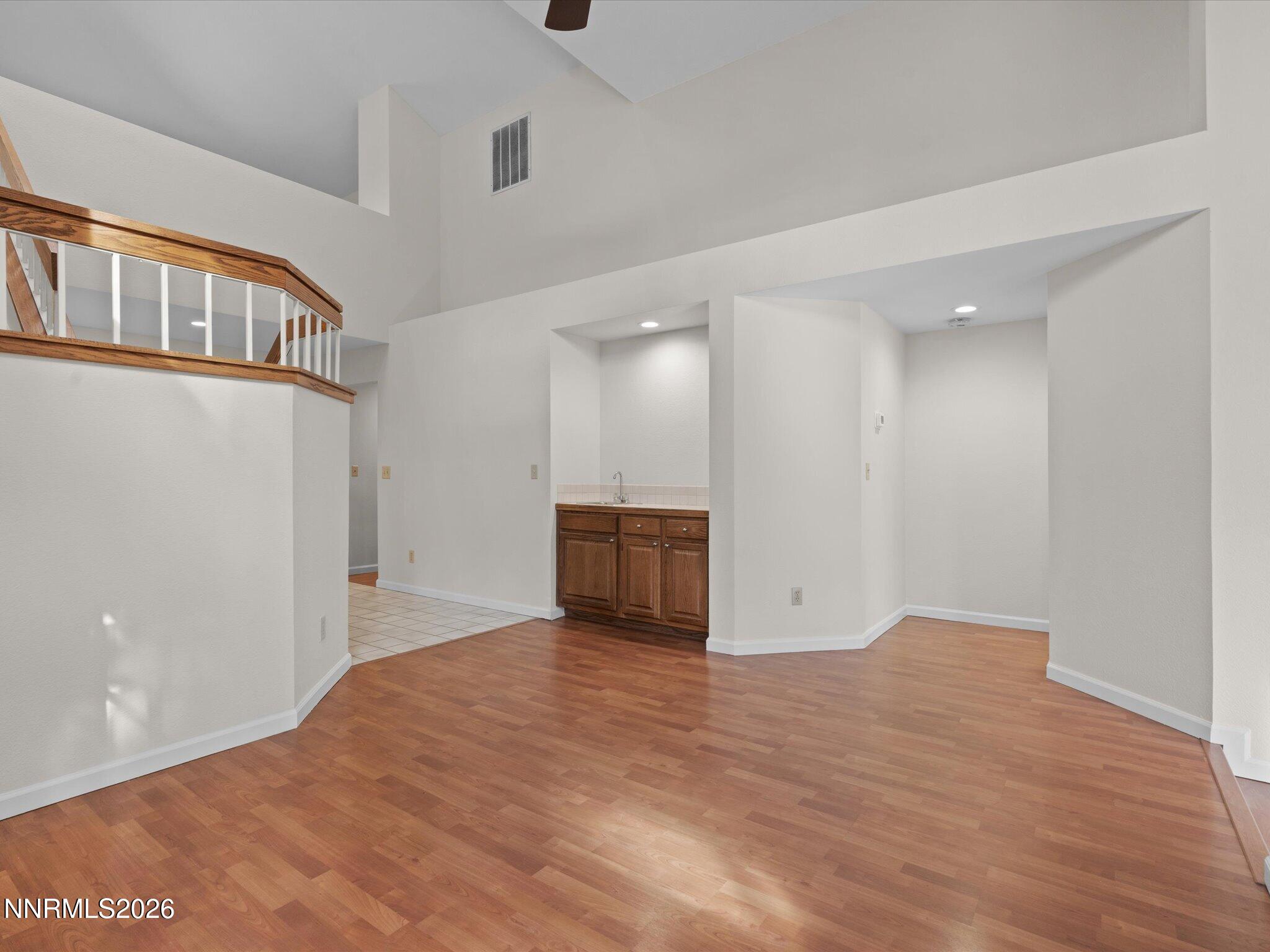 1280 Bridlewood Way Reno, NV 89509 - Photo 11 of 57 a view of an empty room with wooden floor