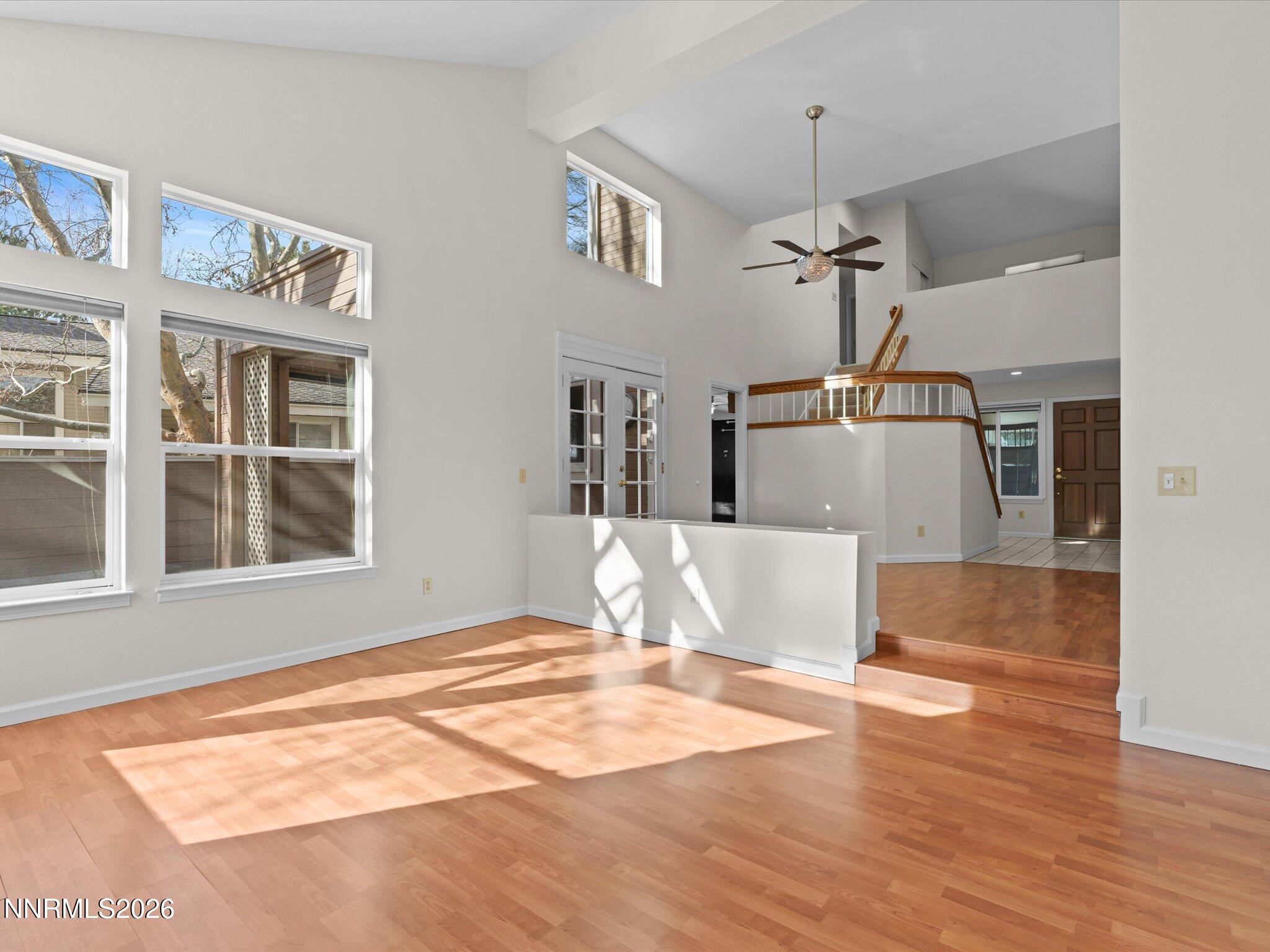 1280 Bridlewood Way Reno, NV 89509 - Photo 14 of 57 a view of a room with wooden floor and a chandelier