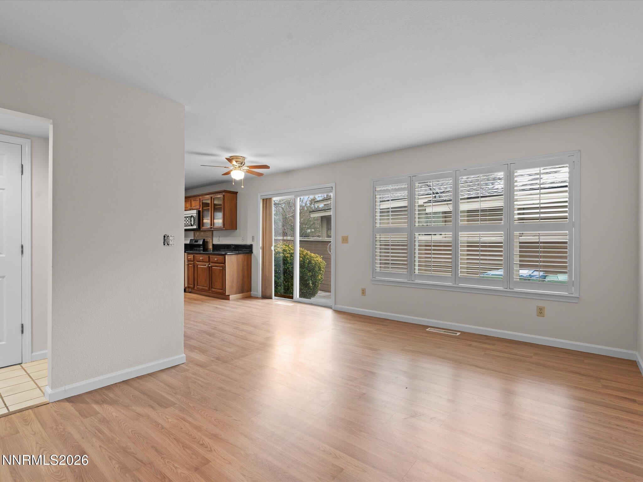 1280 Bridlewood Way Reno, NV 89509 - Photo 20 of 57 wooden floor in an empty room with a window