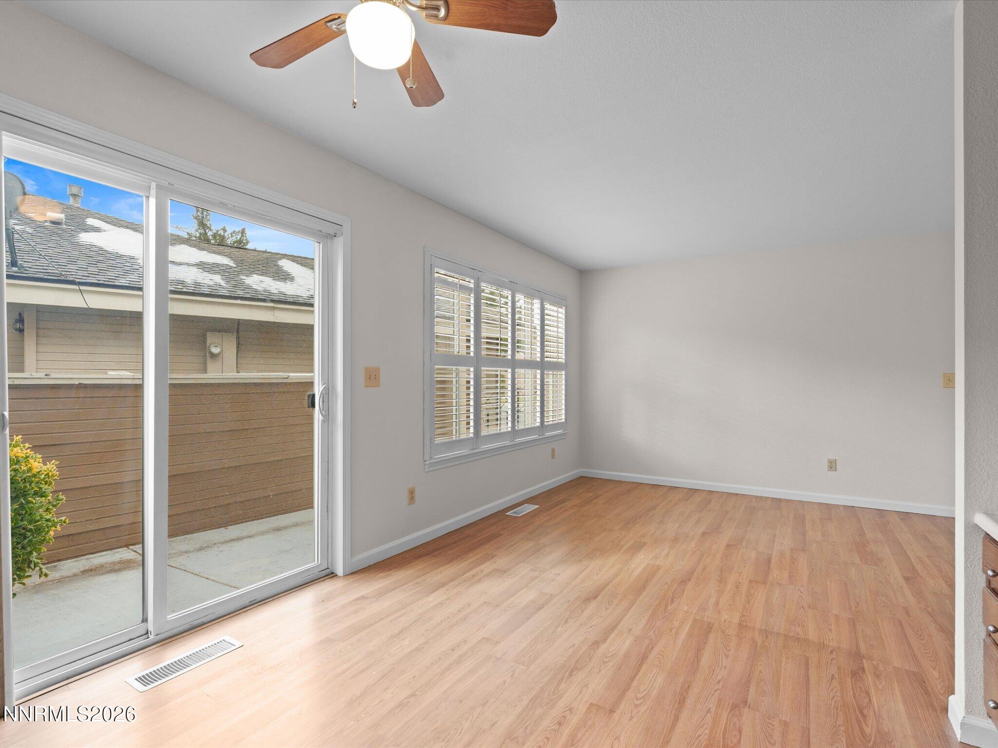1280 Bridlewood Way Reno, NV 89509 - Photo 22 of 57 an empty room with wooden floor and windows