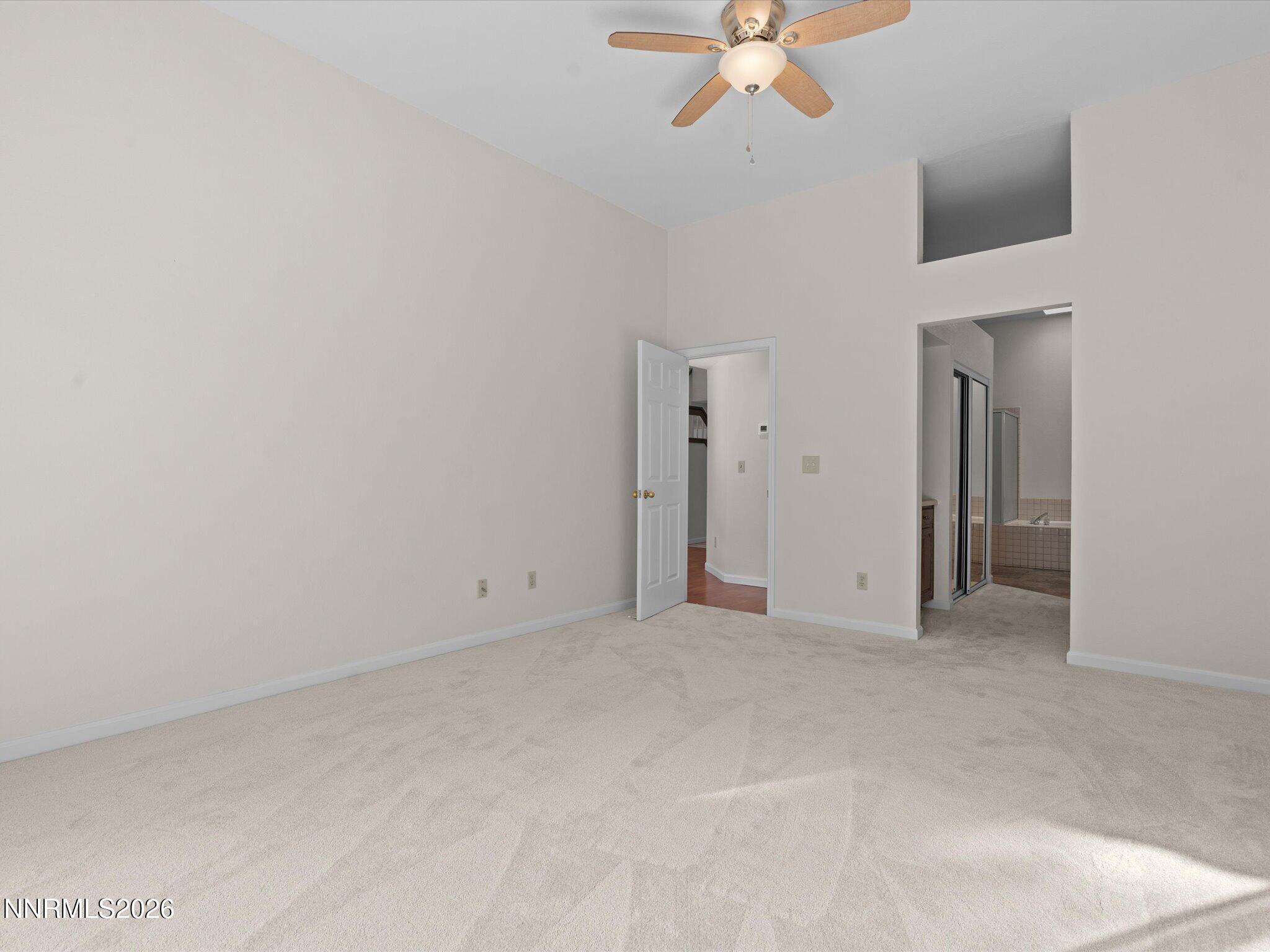 1280 Bridlewood Way Reno, NV 89509 - Photo 26 of 57 a view of an empty room with a chandelier fan