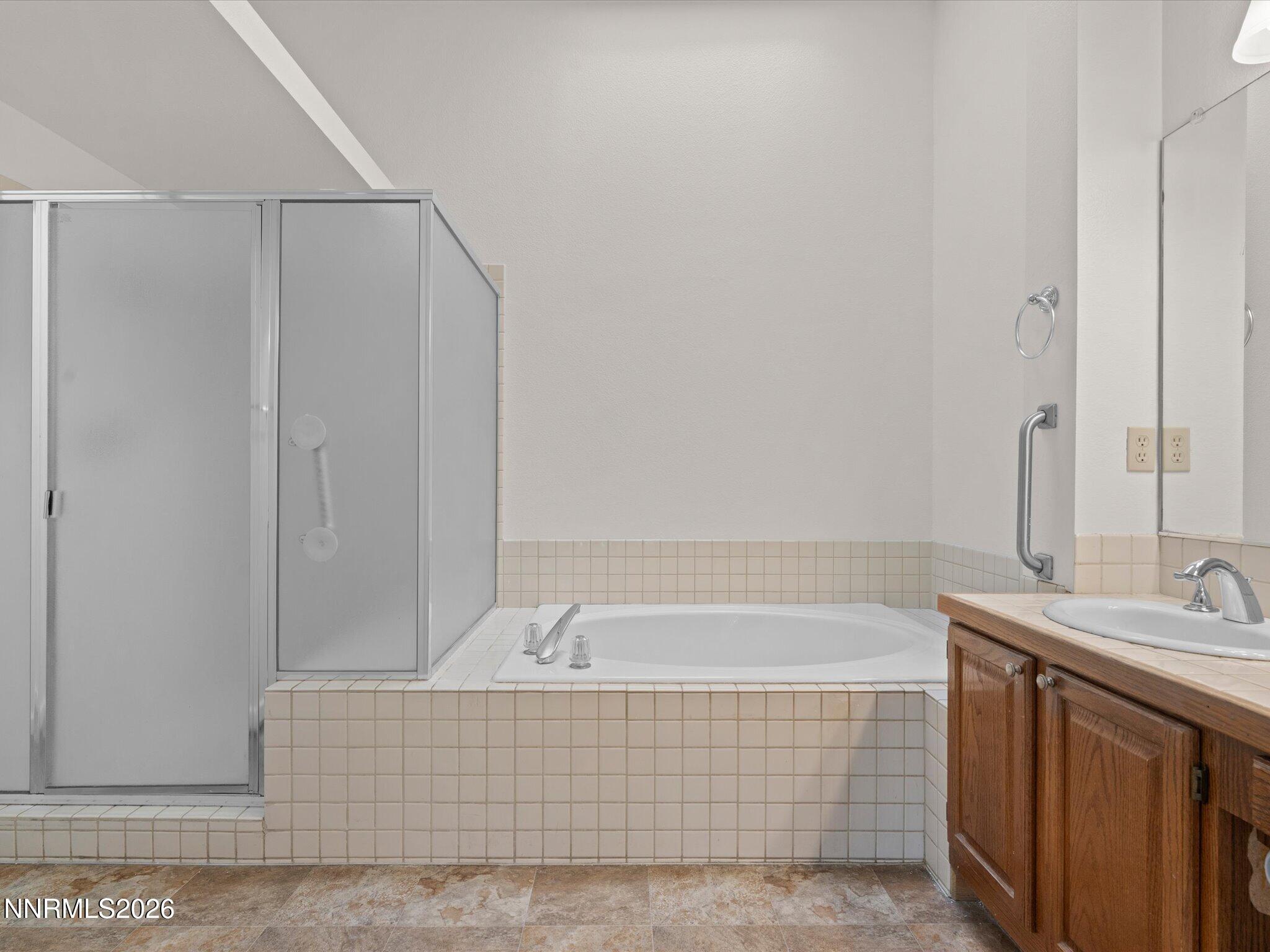 1280 Bridlewood Way Reno, NV 89509 - Photo 29 of 57 a bathroom with a bathtub and a sink