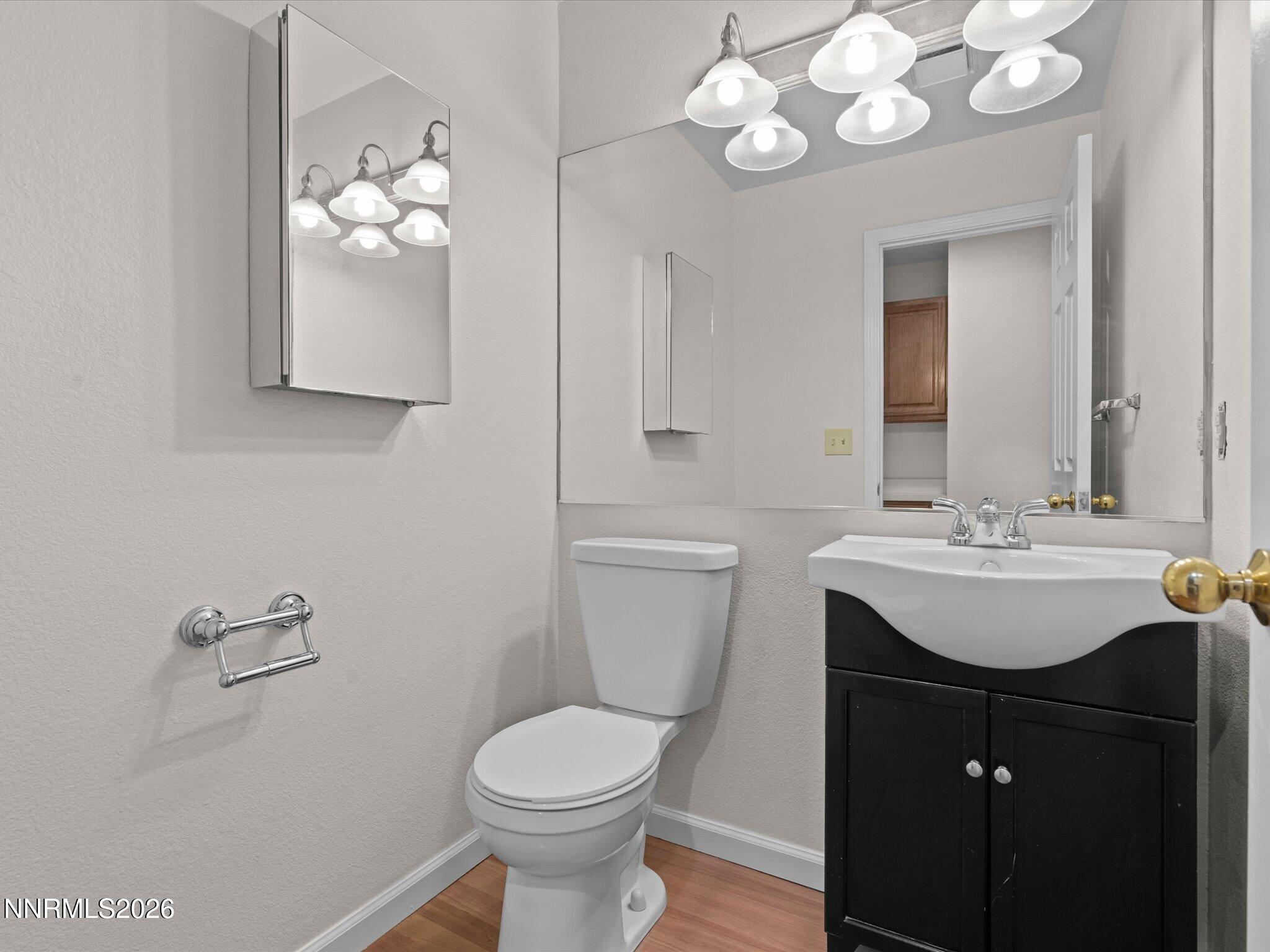 1280 Bridlewood Way Reno, NV 89509 - Photo 33 of 57 a bathroom with a sink a toilet and mirror