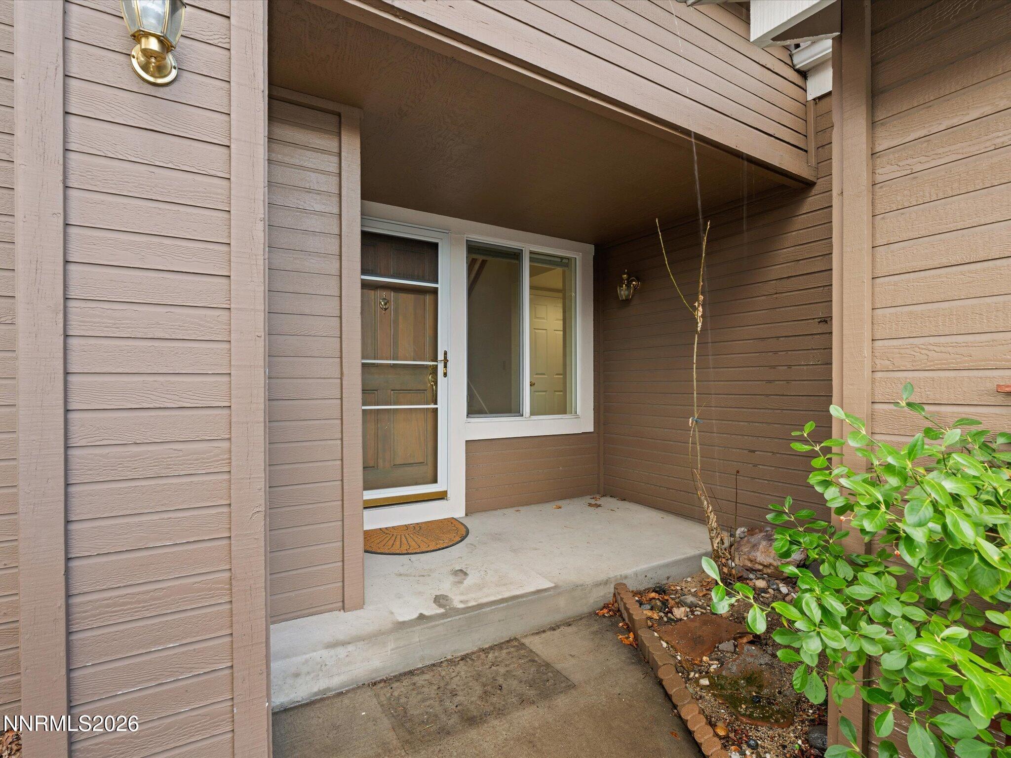 1280 Bridlewood Way Reno, NV 89509 - Photo 4 of 57 a view of house with potted plant and a window