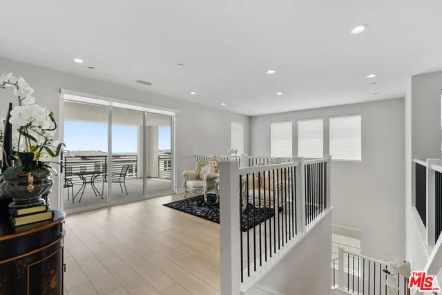 a view of a livingroom with furniture and white floor