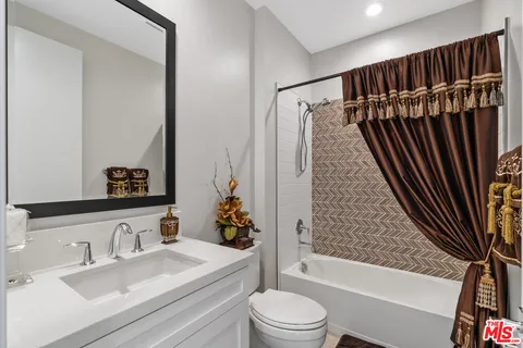 a bathroom with a sink a toilet and a bathtub