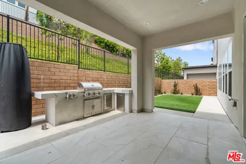 a view of a terrace with a garden and plants