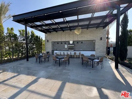 a view of a big room with table and chairs