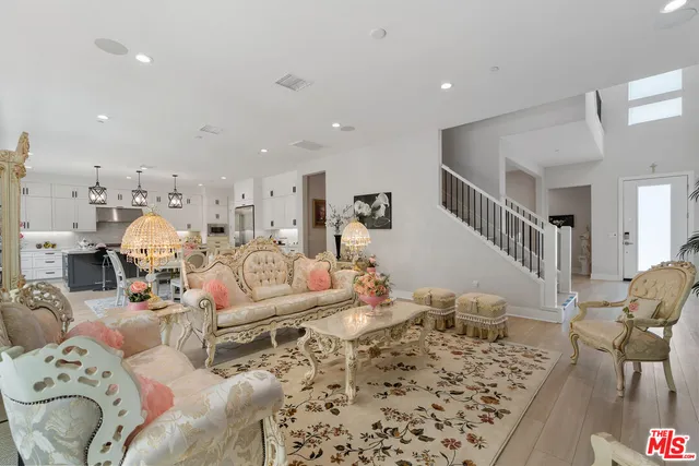 a living room with furniture or couch and a wooden floor