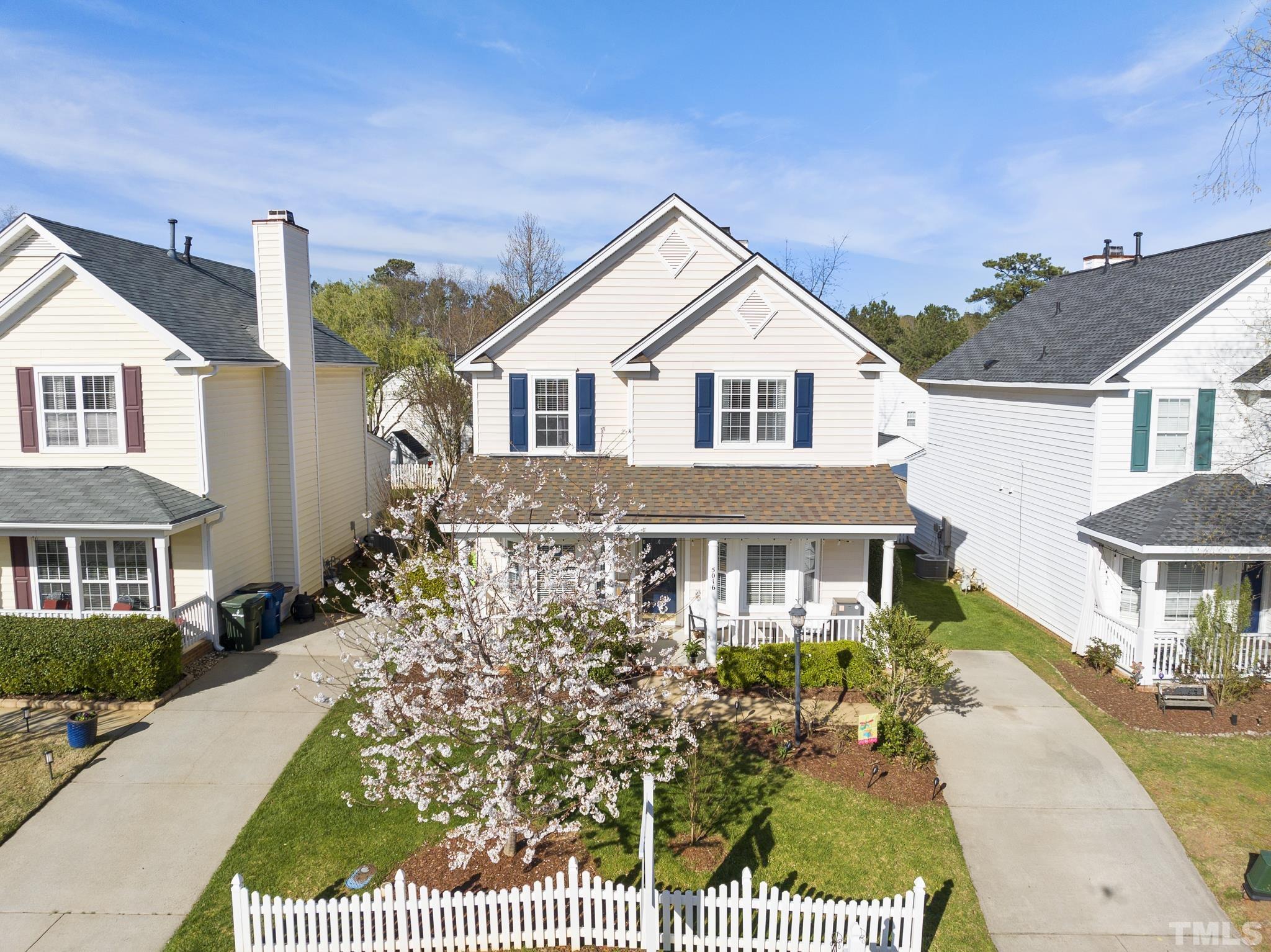 a view of a brick house with a yard